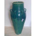 A Persian green and turquoise glazed Sharab wine vessel, H.91cm