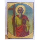 A Greek icon depicting a saint carrying a bible and cross, parcel gilded, painted wooden panel,