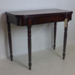 A 19th century mahogany fold over tea table