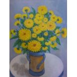 An oil on canvas of yellow chrysanthemums in a vase on a blue ground, unsigned, 55 x 45cm