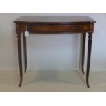 A Regency style inlaid mahogany side table, single drawer, raised on reeded tapered legs and