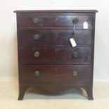 A Regency mahogany chest of four graduating drawers, raised on splayed feet, H.74 W.65 D.45cm