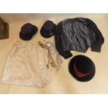 A collection of dress-up items to include 3 hats, a jacket and a skirt