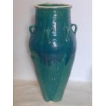 A Persian green and turquoise glazed Sharab wine vessel, H.87cm