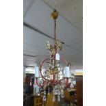 A small vintage red and gilt painted metal chandelier