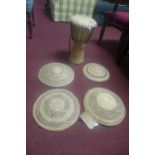 An African drum, H.47cm, together with four South African woven bowls, Diameter 35cm