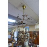 A vintage 7 branch metal chandelier with leaf decoration