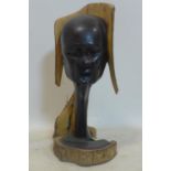 A 20th century African carved ebony bust, signed with initials J.Z. H.52cm
