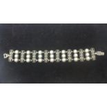 WITHDRAWN - A sterling silver panel bracelet set with floral marcasite sprays