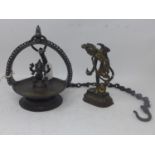 A Tibetan bronze hanging incense burner together with a bronze figure