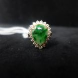 A 9ct yellow gold pear shaped cabbage green jade and diamond set ring