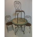 An antique French garden table, having circular mosaic tile top, H.75cm Diameter 83cm, together with