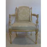 WITHDRAWN- A late 19th/early 20th century French cream and gilt painted armchair
