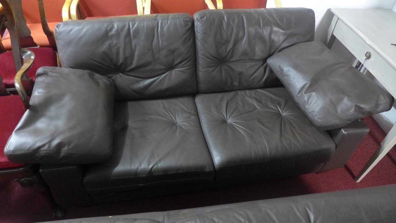 A Heal's brown leather 2 seat sofa