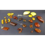 A collection of natural, vintage amber jewellery items to include earrings, pendants and loose