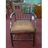 A 19th century mahogany armchair, with drop in seat, on square legs joined by stretchers