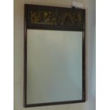 A 20th century Chinese hardwood mirror, with carved panel, 71 x 47cm