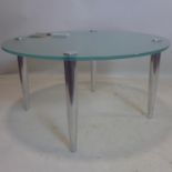 A contemporary coffee table with frosted circular glass top, raised on chrome legs, H.41 D.80cm