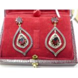 A boxed pair of yellow and white gold stud drop earrings set with brilliant-cut diamonds and faceted