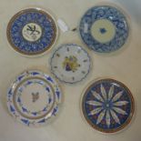 A collection of 5 wall chargers, to include two Middle Eastern examples, and a 19th century