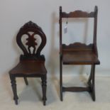 A Victorian carved mahogany folding chairs together with a Victorian mahogany hall chair