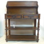 A Victorian mahogany and part ebonized 3 tier buffet, with hinged top above 2 drawers, H.97 W.114