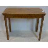 An Art Deco walnut fold over card table