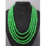 A 4-strand necklace composed of polished spherical natural emerald beads, L: 80cm, 170g, Emerald
