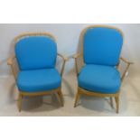A near pair of Ercol armchairs