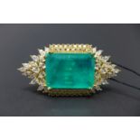 An 18ct yellow gold-plated dress ring set with a large emerald doublet framed by white sapphires,