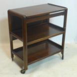 A mid 20th century metamorphic wooden drinks trolley, H.73 W.66 D.41cm