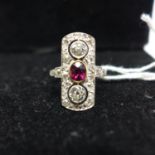 An antique 18ct yellow gold and platinum faceted ruby in collet mounts, and old-cut diamond panel