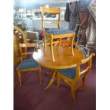 A Regency style circular dining table and four chairs