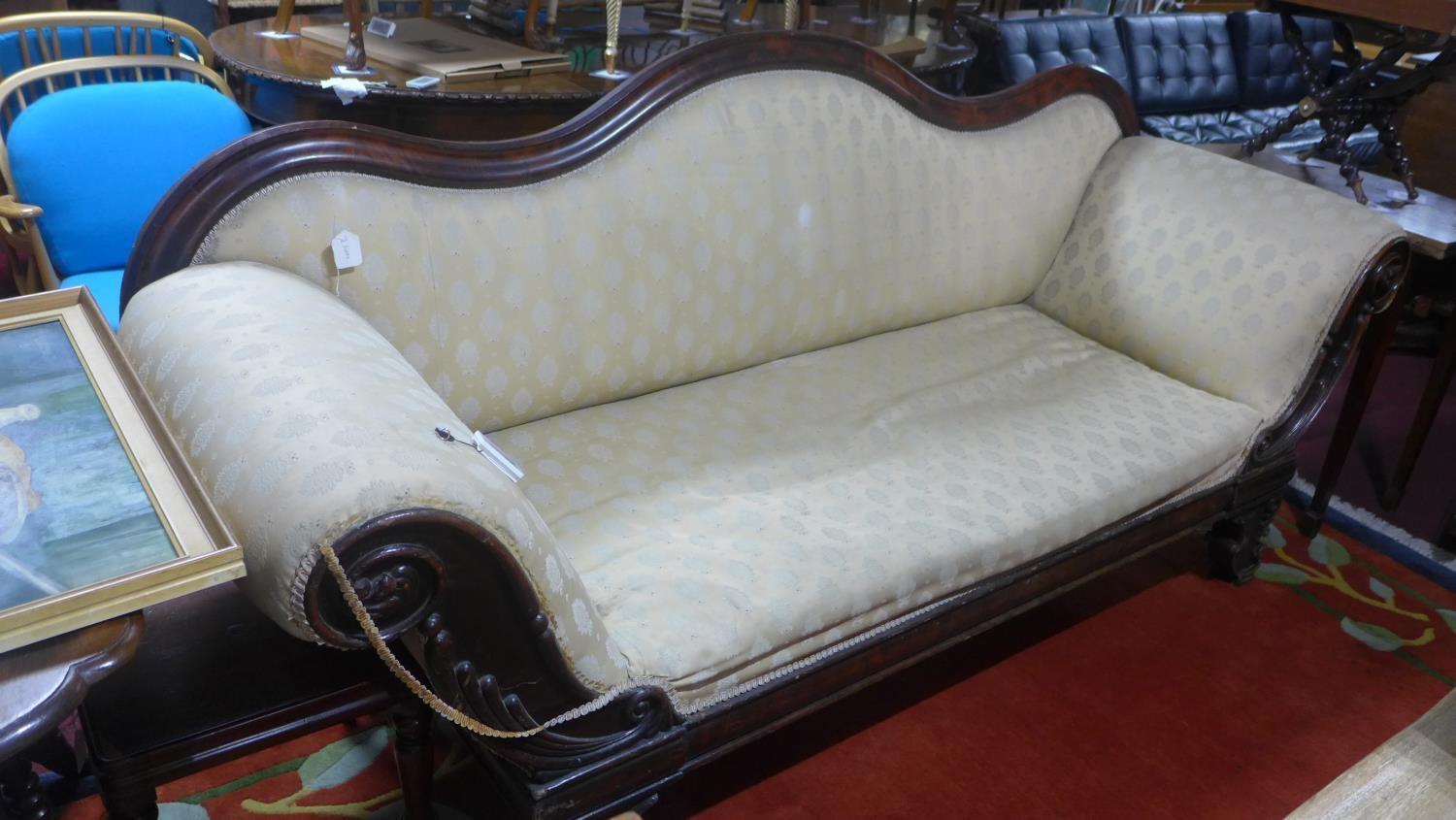 A Regency carved mahogany sofa