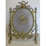 A 19th century ornate ormolu fire guard, H.89 W.66cm