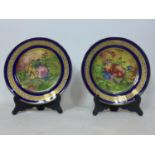 A pair of Limoges hand painted limited edition plates, signed A.J Heritage, D.22cm