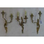 Three Rococo style gilt metal two branch wall sconces, with C-scroll and floral decoration, H.39 W.