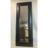 A large leather clad mirror, 222 x 80cm