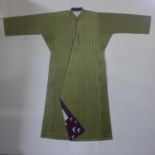 A green and black silk robe/kimono mounted to canvas