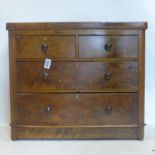 A Victorian walnut chest of drawers, raised on bun feet, H.85 W.101 D.45cm