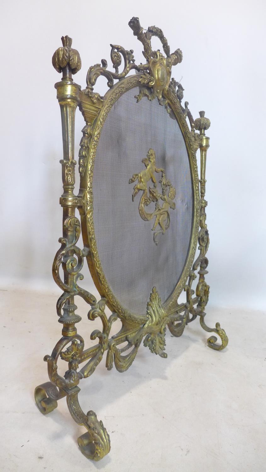 A 19th century ornate ormolu fire guard, H.89 W.66cm - Image 3 of 3