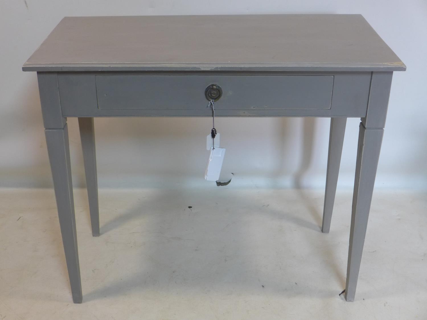 A 20th century painted side table, with single drawer, raised on tapered legs, H.77 W.91 D.47cm