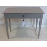 A 20th century painted side table, with single drawer, raised on tapered legs, H.77 W.91 D.47cm