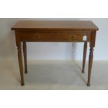 An oak side table with single drawer, raised on turned legs, H.73 W.91 D.40cm