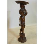 A 19th century carved oak torchere, damaged, H.65cm