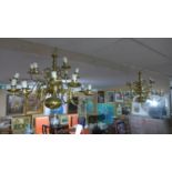 A pair of 20th century 18 branch brass chandeliers