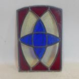 A Victorian stained glass and leaded panel in shades of blue, red and clear glass, 44 x 29cm