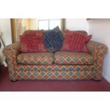A 20th century sofa, the upholstery decorated with geometric patterns