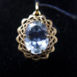 A high carat yellow gold mounted pendant centrally set with a faceted aquamarine to a gold pendant