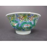 A Chinese docai bowl, decorated with dragons amongst scrolling foliage, bearing six character